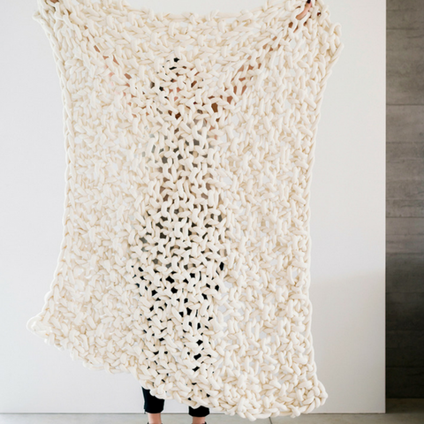 Plump & co chunky knit blanket in white giant yarn 1 ply made of felted New Zealand merino bulky wool using extreme knitting needles, XXL knitting and giant crochet hooks, Individual bumps, ottomans, giant weaving, cushions, wall hangings, key rings, and extreme knitting kits available. Worldwide shipping to USA, Canada, UK, Australia, Texas, New Zealand, Japan, Korea 