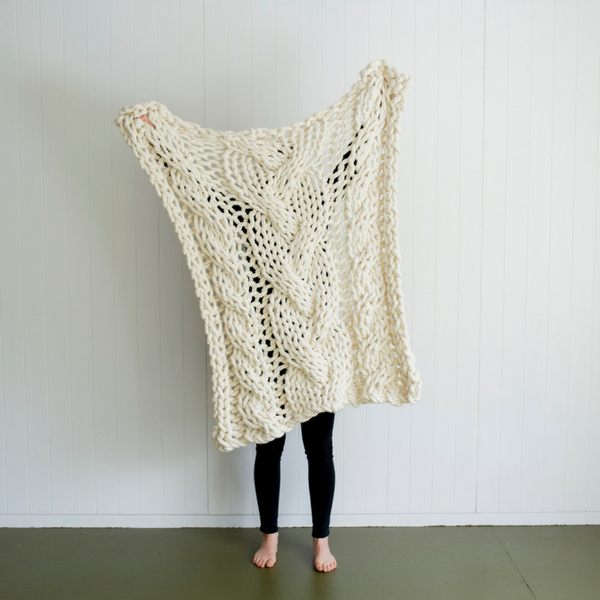 Knit your own beautiful chunky yarn blanket to add texture to your home.