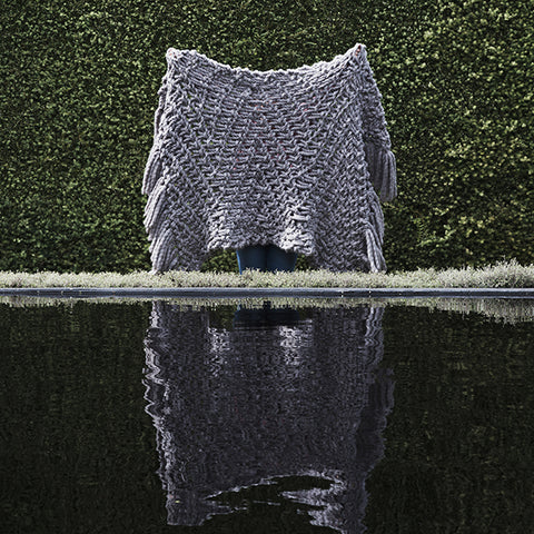 Create this chunky arm knitted blanket using the Herringbone stitch. We used five chunky wool merino bumps of Plump & co 2 ply grey yarn, with Giant 45mm Needles from Plump & Co. in New Zealand and Australia. With chunky wool merino knits and layers of textures for your home inspiration.