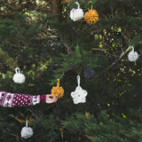 Create this chunky arm knitted DIY Christmas pompom using chunky wool mini 2ply cheese merino yarn of Plump & Co 2 ply white pink grey and mustard yarn, from Plump & Co. in New Zealand and Australia. With chunky wool merino knits and layers of textures for your home inspiration.