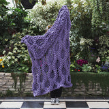 Create this chunky arm knitted blanket using the honeycomb stitch. We used chunky wool merino bumps of Plump & Co 1 ply white and purple yarn, with Giant 45mm Needles from Plump & Co. In New Zealand and Australia. With chunky wool merino knits and layers of textures for your home inspiration.