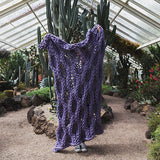 Create this chunky arm knitted blanket using the honeycomb stitch. We used chunky wool merino bumps of Plump & Co 1 ply white and purple yarn, with Giant 45mm Needles from Plump & Co. In New Zealand and Australia. With chunky wool merino knits and layers of textures for your home inspiration.