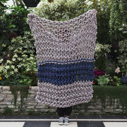 Create this chunky arm knitted blanket using the plain Garter stitch. We used chunky wool merino bumps of Plump & Co 1 ply grey and blue yarn, with Giant 45mm Needles from Plump & Co. In New Zealand and Australia. With chunky wool merino knits and layers of textures for your home inspiration.