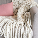 Chunky yarn blanket knitted using Plump & Co 2 ply merino yarn