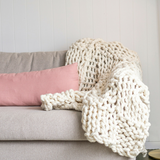 Knit your own beautiful chunky yarn blanket to add texture to your home.