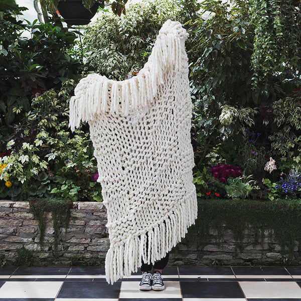 Create this chunky arm knitted blanket using the basket knit stitch. We used five chunky wool merino bumps of Plump & co 2 ply white yarn, with Giant 45mm Needles from Plump & Co. in New Zealand and Australia. With chunky wool merino knits and layers of textures for your home inspiration.
