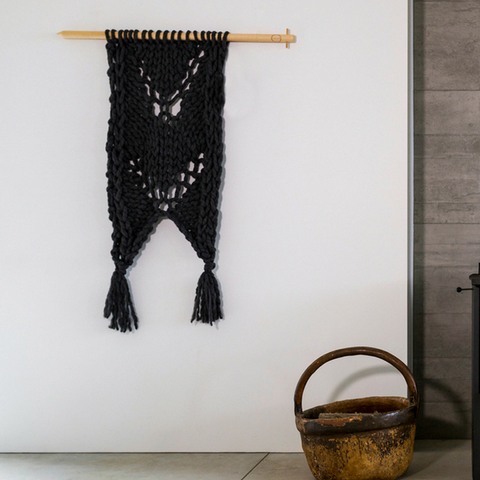 Knit your own beautiful chunky yarn wall hanging to add texture to your home.